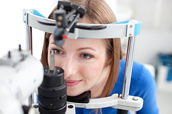 woman receiving an eye exam