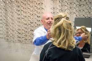 Eyeglasses Troy Woman being fitted for eyeglasses